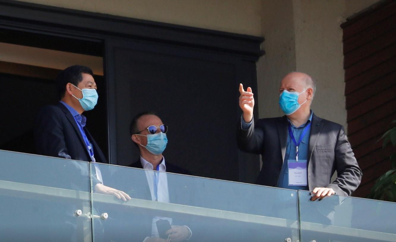 Peter Daszak, a member of the World Health Organization (WHO) team tasked with investigating the origins of the coronavirus disease (COVID-19), gestures next to other members on a balcony at a hotel in Wuhan, Hubei province, China January 29, 2021. - Avaz