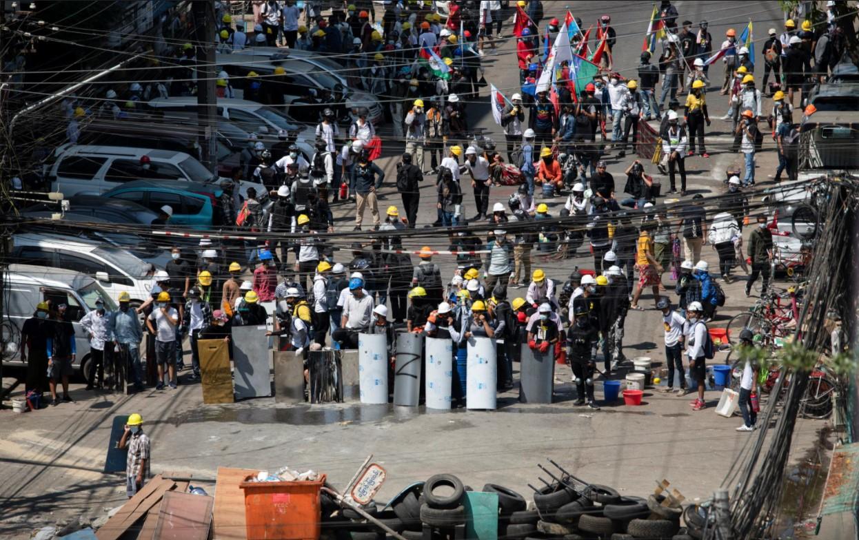 Demonstrators block a road during an anti-coup protest in Yangon, Myanmar, March 4, 2021. - Avaz