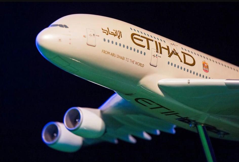 A model Etihad Airways plane is seen on stage in New York, U.S. November 13, 2014. - Avaz