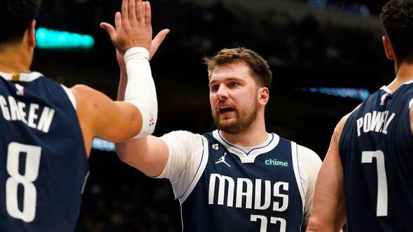 Dallas Mavericks guard Luka Doncic (77) and teammate Josh Green (8) celebrate during the second half of an NBA basketball game against the Miami Heat in Dallas - Avaz